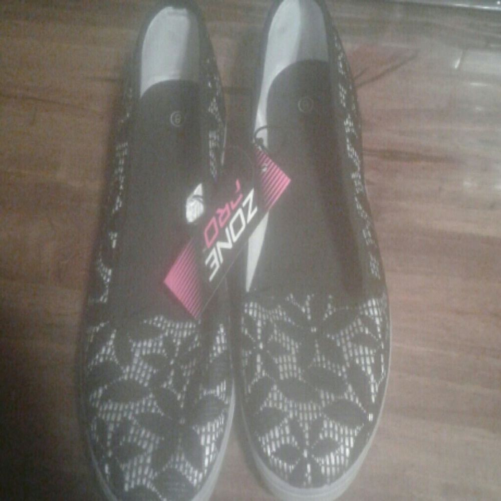 Black and white slip ons